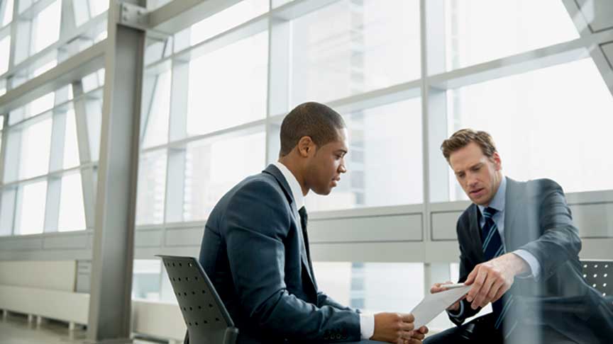 business-guys-talking-about-implementing-a-coaching-culture-to-promote-truth-and-courage-center-for-creative-leadership-ccl