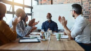 people discussing gratitude at work; explaining how showing gratitude in the workplace is helpful and why gratitude in leadership matters